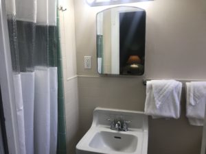 A bathroom sink with a mirror