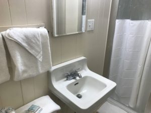 A bathroom sink with a mirror