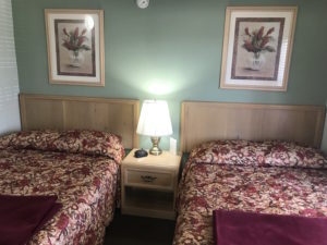 Two beds with two picture frames