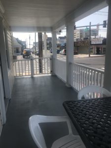 Two chairs and a table on a balcony