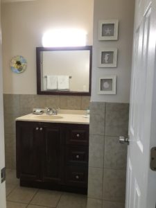A bathroom sink and a mirror
